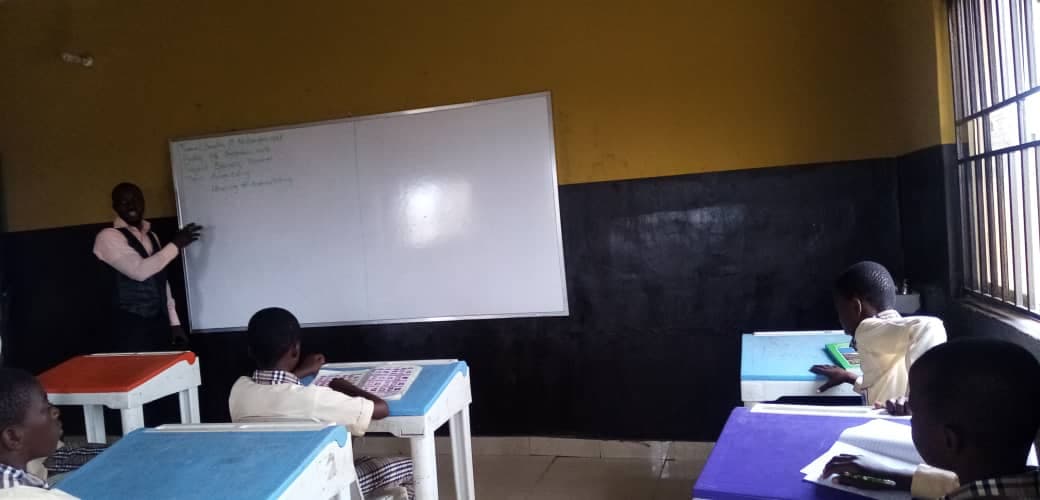 Teacher instructing at whiteboard